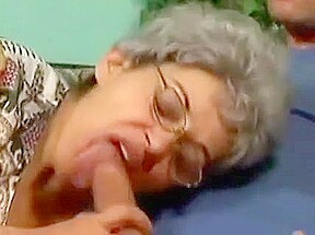A granny in glasses and her young stud