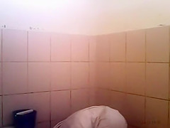 Arab woman goes pee in a public toilet