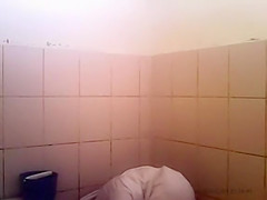 Arab woman goes pee in a public toilet