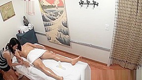 Asian masseuse jerking and fucking her client