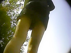 Attractive Girl Wearing A Short Skirt Gets Caught On A Hidd
