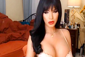 Beautiful big tits tranny wanks her hard cock