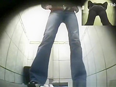 Blonde girl in tight jeans pants peeing