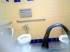 Bootylicious black MILF pees in a restroom