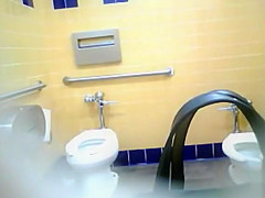 Bootylicious black MILF pees in a restroom
