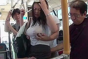 Breasty woman soaked with rain in bus