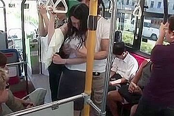 Breasty woman soaked with rain in bus
