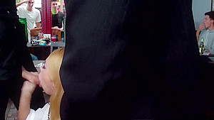 Busty blonde gives double blowjob in public