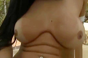 Busty tranny babe gets naked and jerks it outdoors