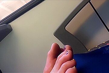 Candid closeup of blonde feet on train 25