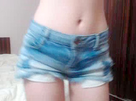 Cute blonde fondles her large tits on webcam