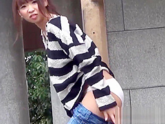 Dashing Japanese chick strips nude and masturbates outdoors