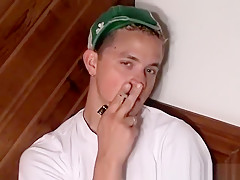 Freaky homo tugs his big dick while taking a smoke solo