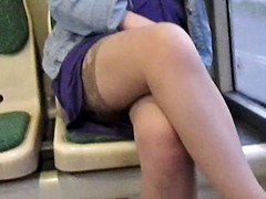 Girl flashing stockings in a bus