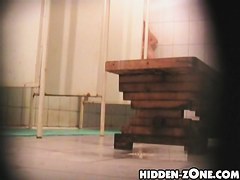 Girl hiding her nudity from kinky shower cameraman