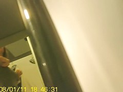 Girl in fitting room posing in new top before mirror