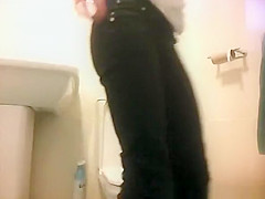 Girl in glasses spied taking a piss