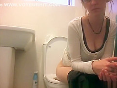 Girl in glasses spied taking a piss