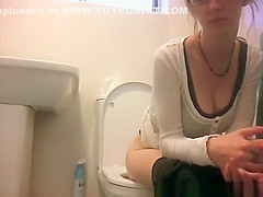 Girl in glasses spied taking a piss