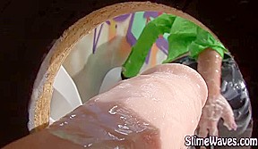 Gloryhole bitch sucks fake cock