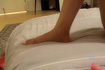 Gorgeous brunette with small boobs, Sophia Leone is smoking and giving a hot, POV footjob