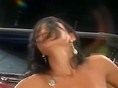 Gorgeous tanned babe is fucked on a vintage car