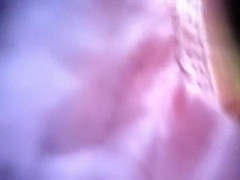 Hairy pubic bush spied under a skirt