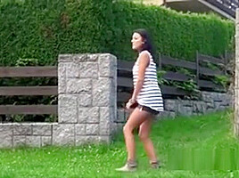 Half Naked Brunette Pissing Behind A Building