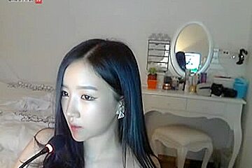 Heavenly beautiful Asian girl in a uniform stripping on cam