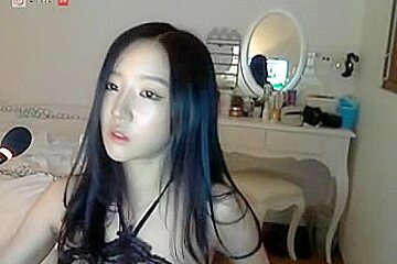 Heavenly beautiful Asian girl in a uniform stripping on cam