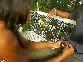 Horny ebony jerking off a lucky guy outdoors