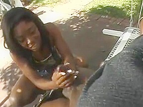 Horny ebony jerking off a lucky guy outdoors