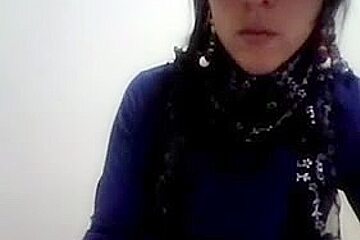 Hot Latina women with glasses enjoys stripping on cam