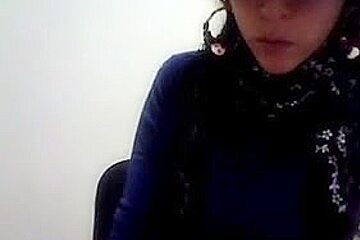Hot Latina women with glasses enjoys stripping on cam