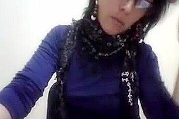 Hot Latina women with glasses enjoys stripping on cam