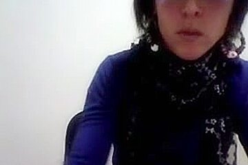Hot Latina women with glasses enjoys stripping on cam