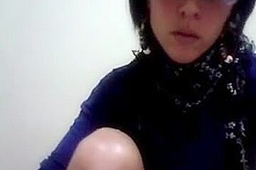 Hot Latina women with glasses enjoys stripping on cam