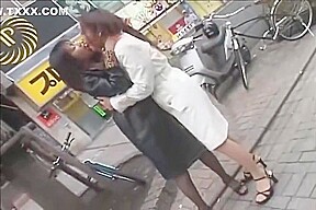Japanese lesbians kissing on the street then in a hotel room