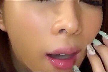 Japanese with long nails gives a great blowjob on bed