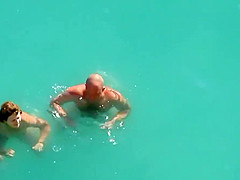 Kama Sutra on the beach Couples have sex in the sea