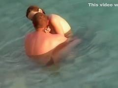 Kama Sutra on the beach Couples have sex in the sea