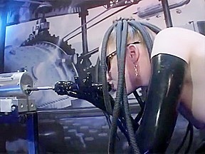 Latex beauty fucks dildo machine