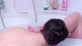 Licking her feet in the tub by Foot Girls