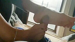 Milf Give a Footjob in a Hotel