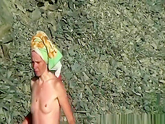 Nudist man and women washing their bodies