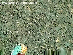 Nudist man and women washing their bodies
