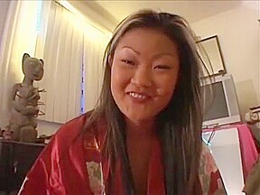 Rampant Asian Lucy Lee gives a seducing walk around room then sucks cock
