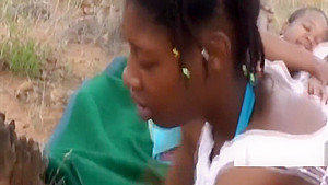 Sexy black babe blowing dick outdoors