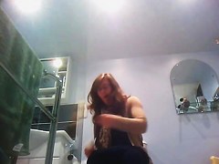 Sexy milf looking around when pissing on the toilet