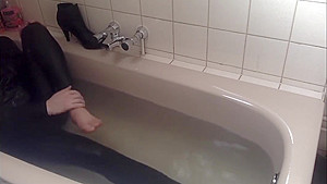 Sexy tight pants ankle boots and heels in bath